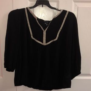Black shirt with white v-neck